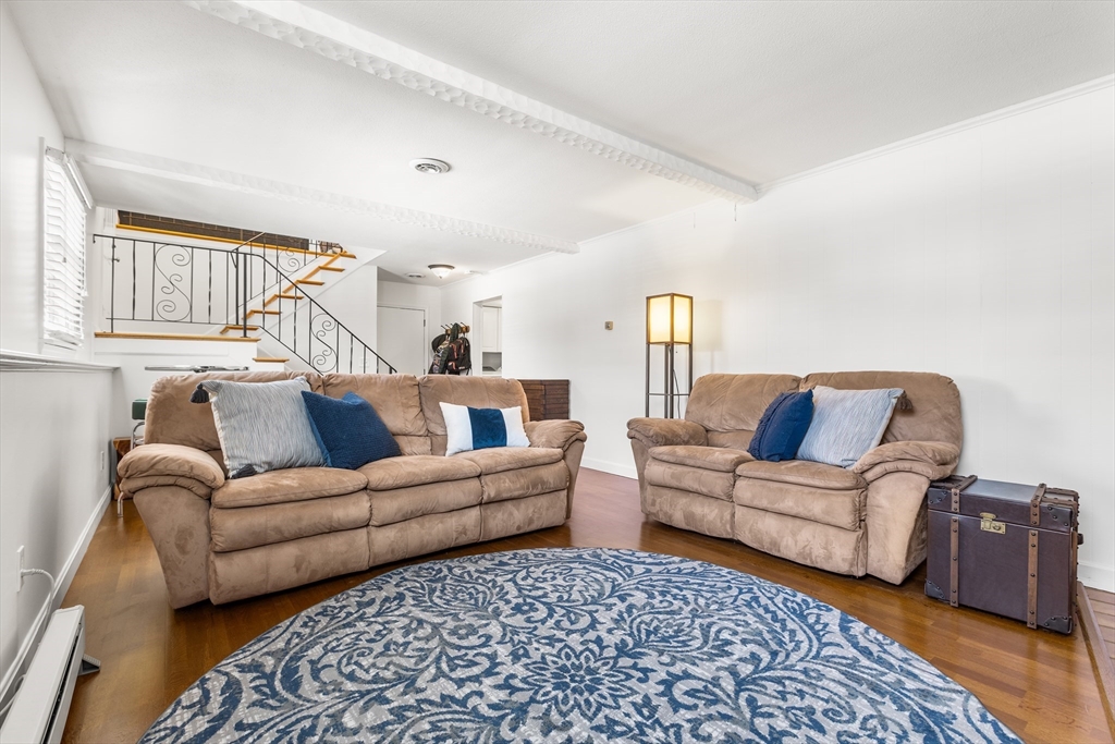 27 Audubon Road Reading, MA 01867 - Photo 24 of 35 a living room with furniture and a window