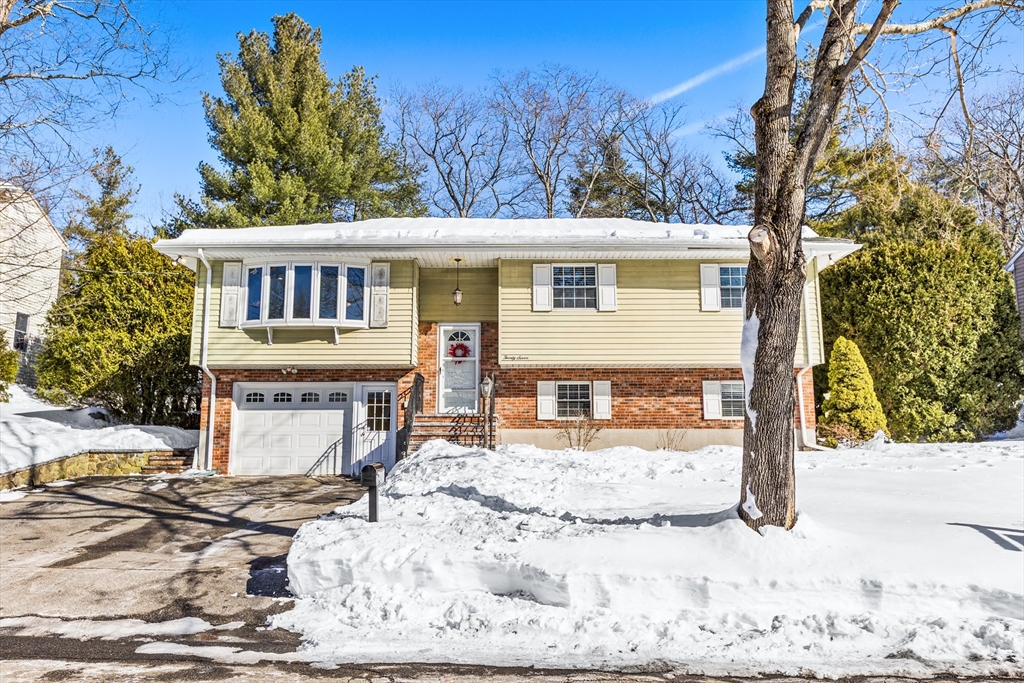 27 Audubon Road Reading, MA 01867 - Photo 30 of 35 a front view of a house with a yard