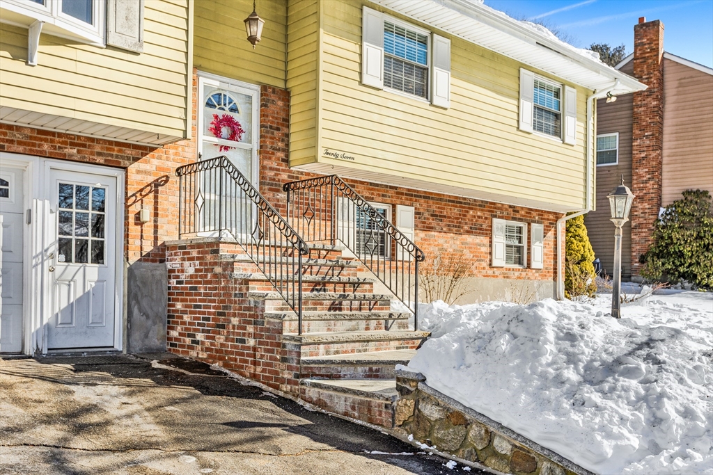 27 Audubon Road Reading, MA 01867 - Photo 31 of 35 a front view of a house with a garage
