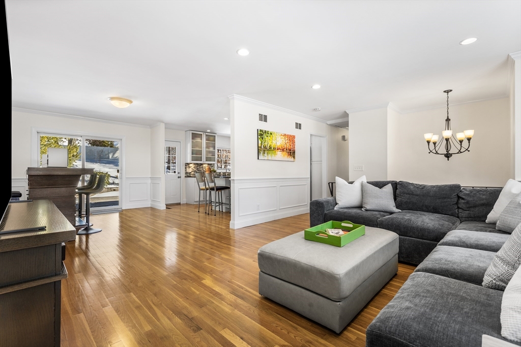 27 Audubon Road Reading, MA 01867 - Photo 8 of 35 a living room with furniture and a wooden floor