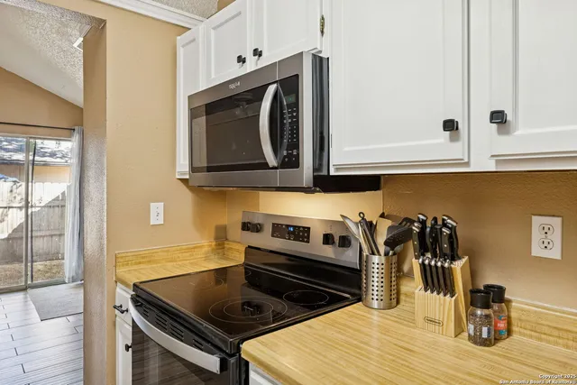 a kitchen with a stove and a microwave