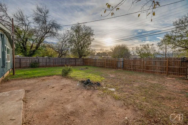 a view of a backyard with a trees