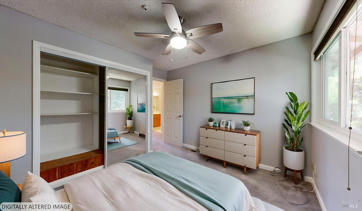 4571 Harbor Lane Rohnert Park, CA 94928 - Photo 46 of 79 a bedroom with a bed and a potted plant