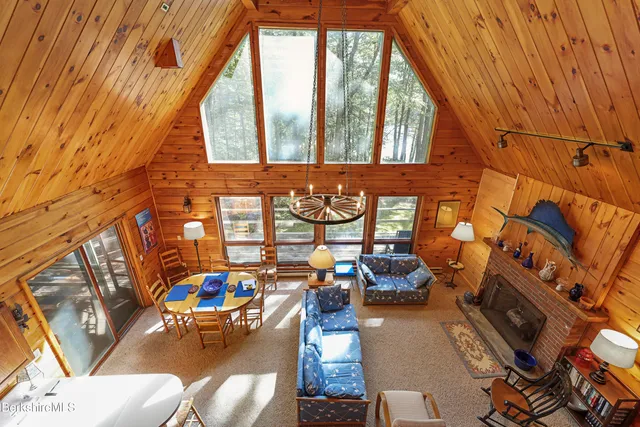 swimming pool view with couches and chairs