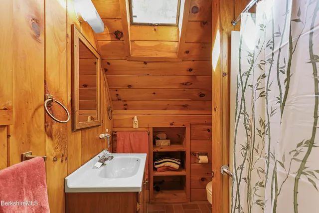 a bathroom with a sink and mirror