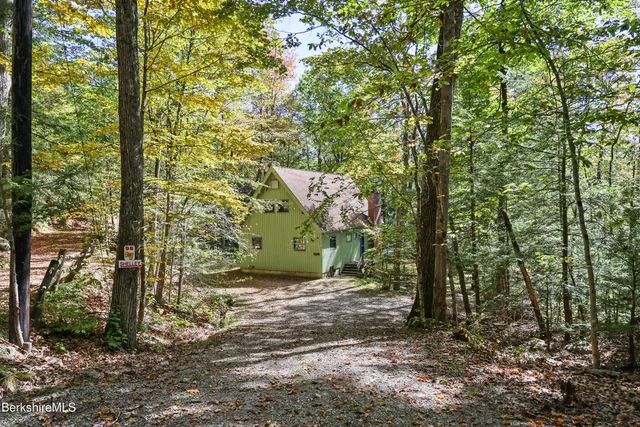 a view of backyard with tub and trees