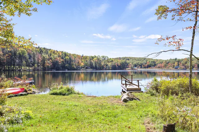 an aerial view of a houses with a yard