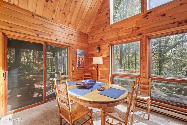 a view of a patio with a table and chairs