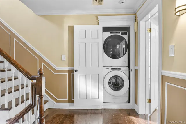 a view of a hallway with washer and dryer