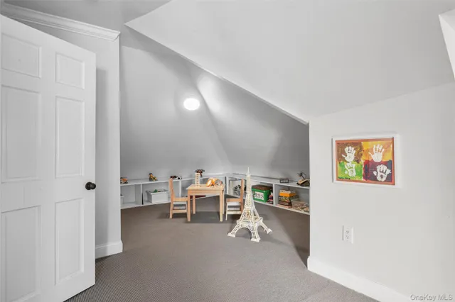 a room with furniture and a view of living room