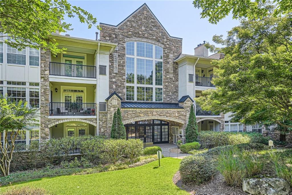 3047 Lenox Road Northeast, Unit 1204 Atlanta, GA 30324 - Photo 1 of 1 a front view of a house with garden