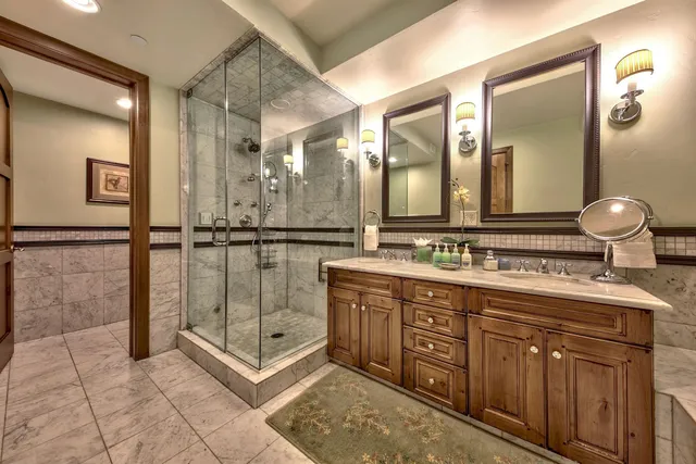 a bathroom with a double vanity sink mirror and double