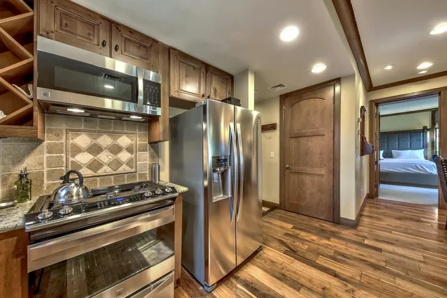a kitchen with a stove and a refrigerator