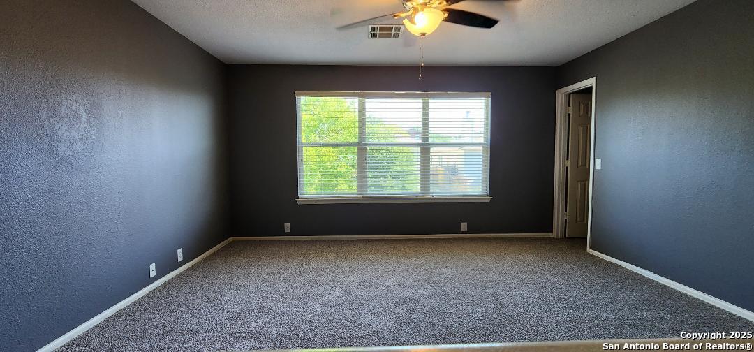 15710 Robin View San Antonio, TX 78255 - Photo 11 of 26 an empty room with a window