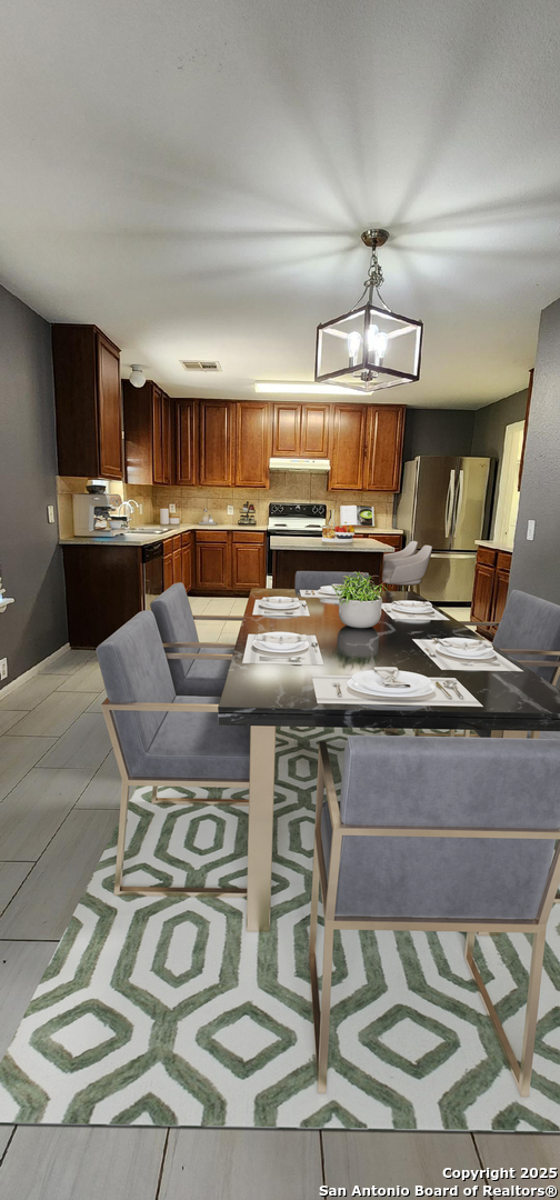 15710 Robin View San Antonio, TX 78255 - Photo 4 of 26 a living room with stainless steel appliances kitchen island granite countertop a sink and cabinets