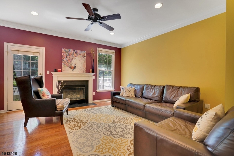 8 Hancock Court Bernards, NJ 07920 - Photo 11 of 25 a living room with furniture and a fireplace