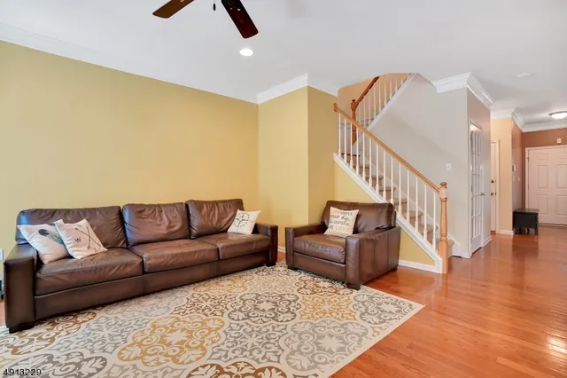 a living room with furniture and a rug