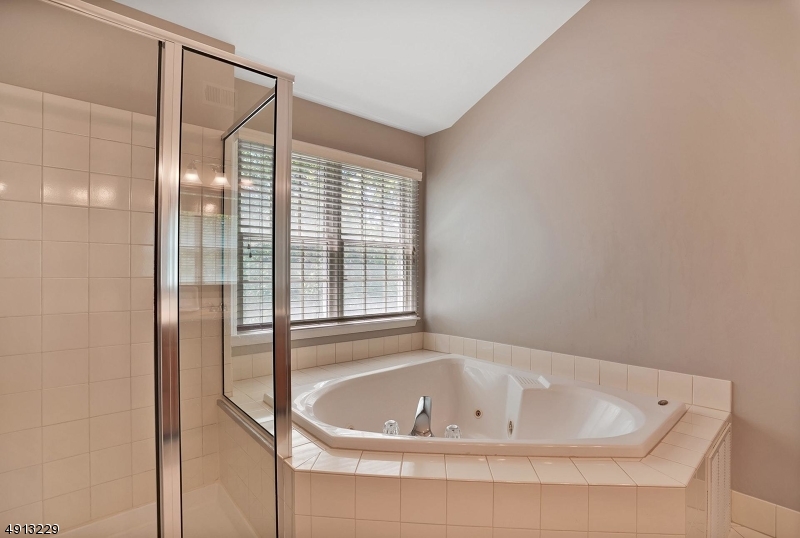 8 Hancock Court Bernards, NJ 07920 - Photo 17 of 25 a bathroom with a tub and shower