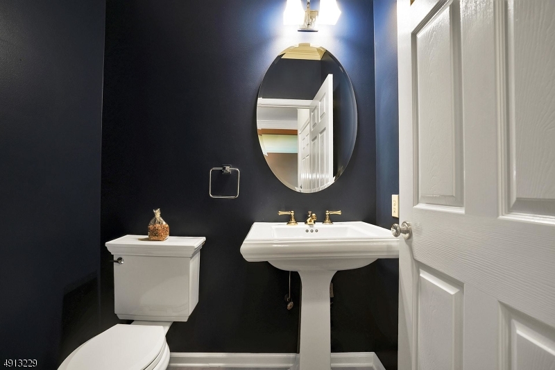 8 Hancock Court Bernards, NJ 07920 - Photo 21 of 25 a bathroom with a toilet sink and mirror