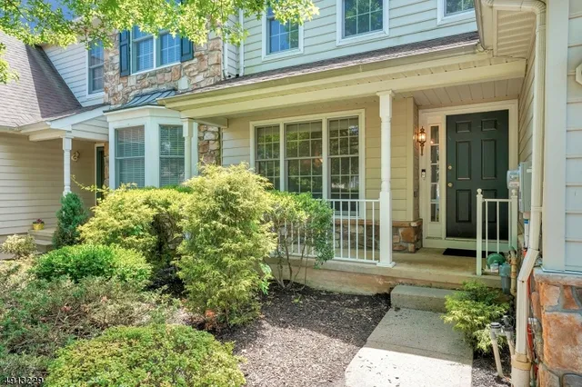 a view of a house with potted plants