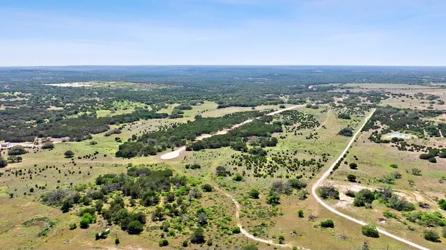 a view of a lake with a yard