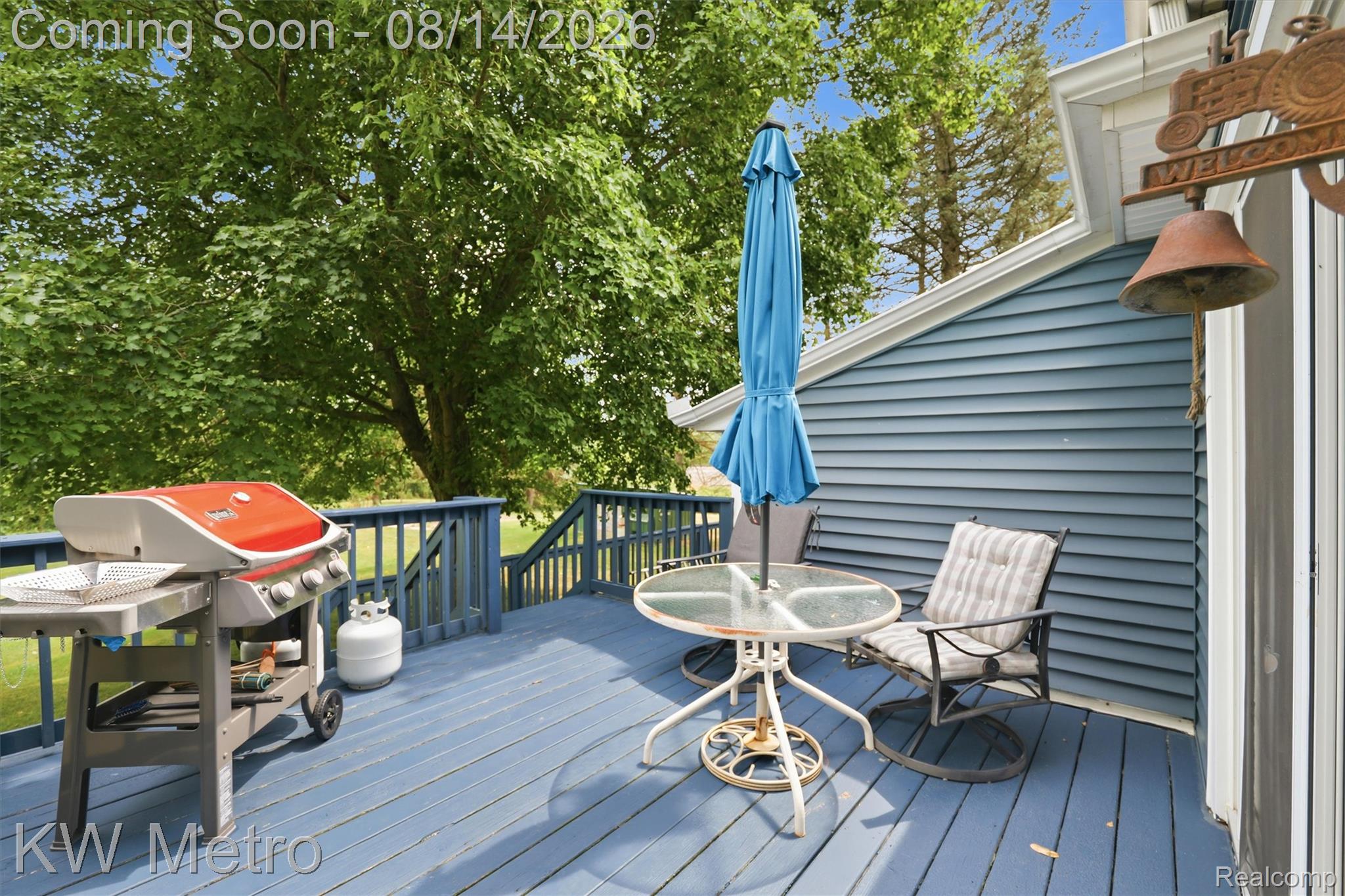 201 South Maple Leaf Road Lapeer, MI 48446 - Photo 36 of 70 Outdoor deck with blue-painted wood flooring, blue railings, and exterior siding