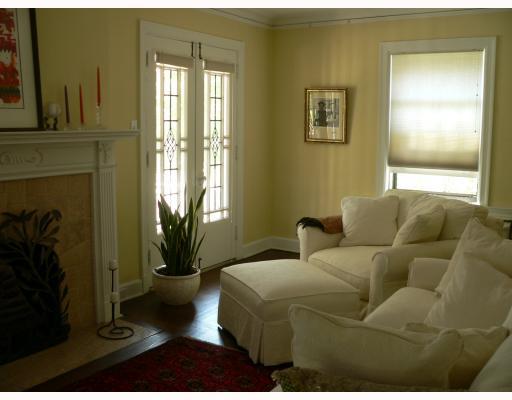908 Wellesley Road Highland Park, PA 15206 - Photo 2 of 8 Living Room. Fireplace is flanked by leaded glass doors that open to front porch. Hardwood floors too!