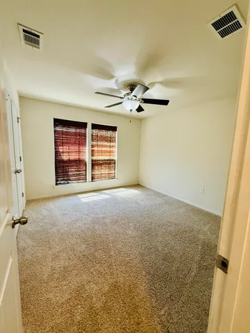 a view of an empty room with a fireplace