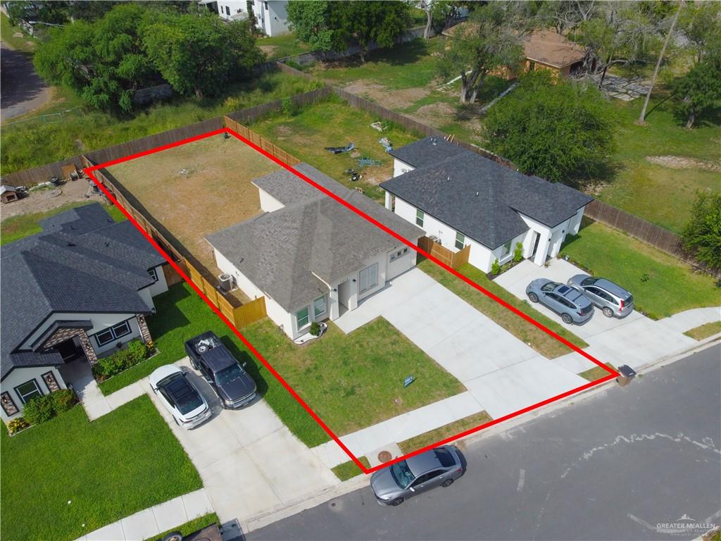 1920 Trinity Street Donna, TX 78537 - Photo 23 of 23 Modern single-story home featuring a dark shingle roof and light-colored exterior