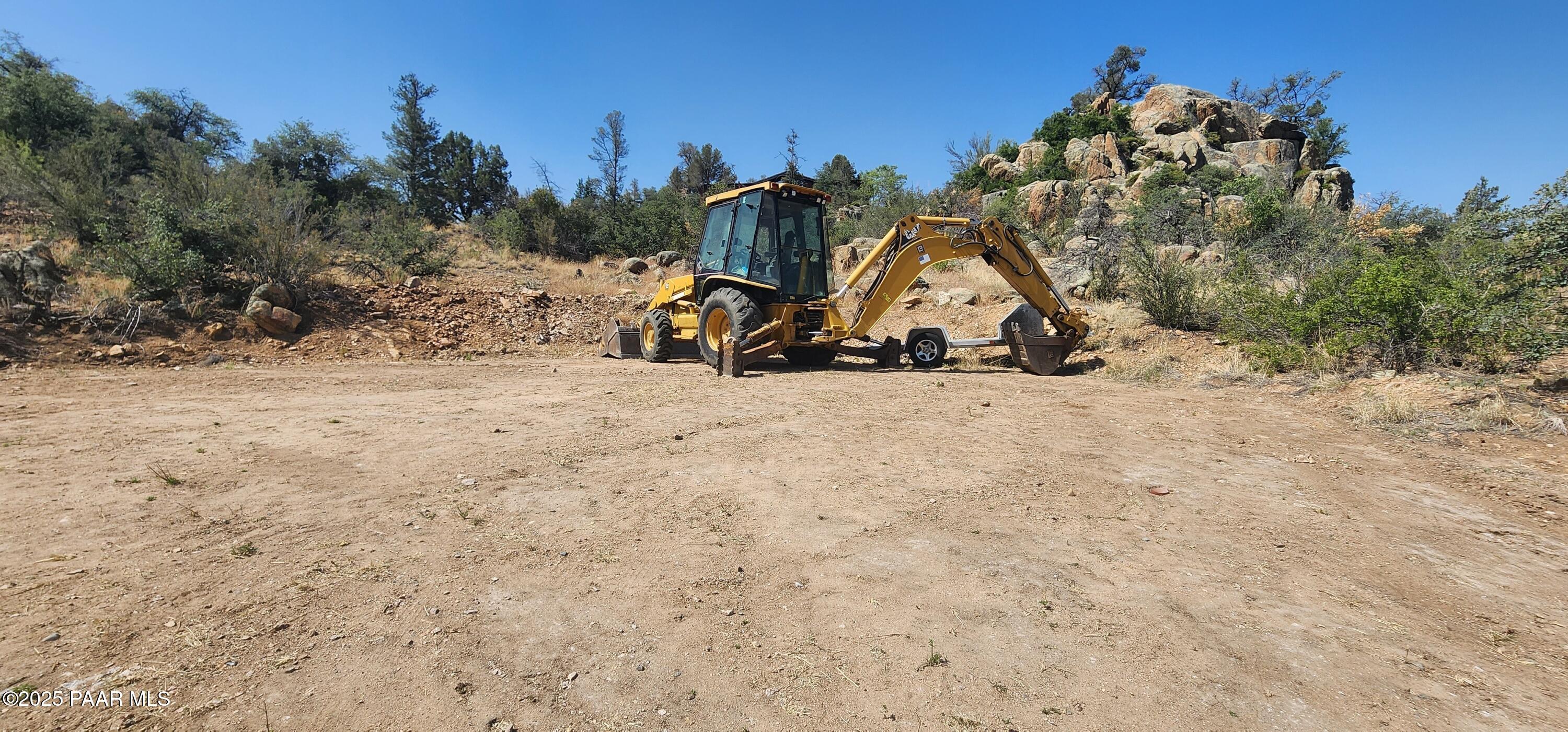 2291 Willow Creek Road Prescott, AZ 86301 - Photo 5 of 16 a view of a backyard with a tree in the background