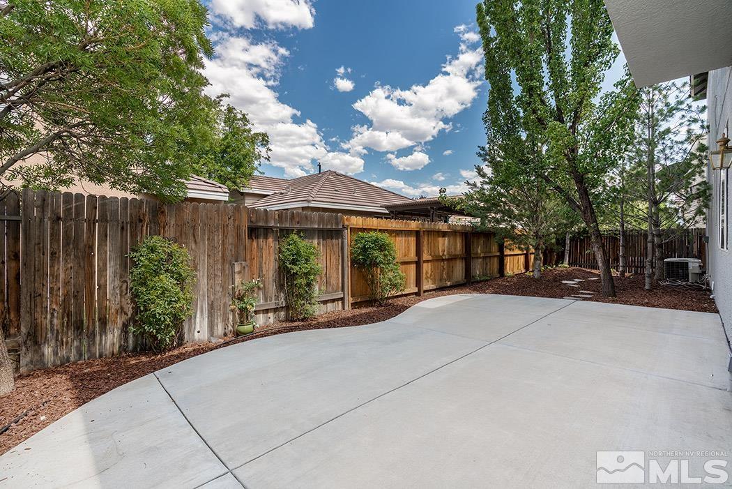 9646 Otter Way Reno, NV 89521 - Photo 3 of 25 a view of a house with backyard and sitting area