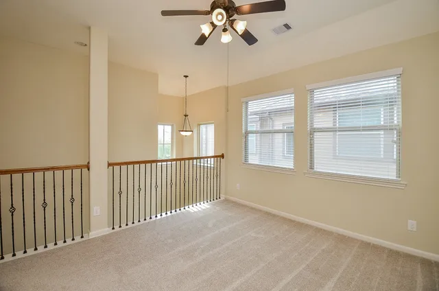 a view of empty room with windows