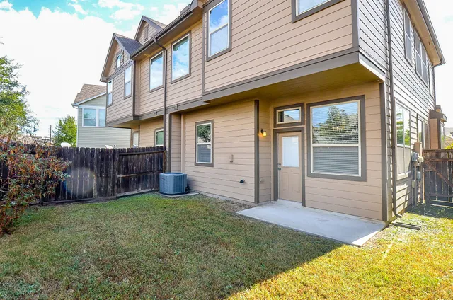 a view of a house with a yard and sitting area
