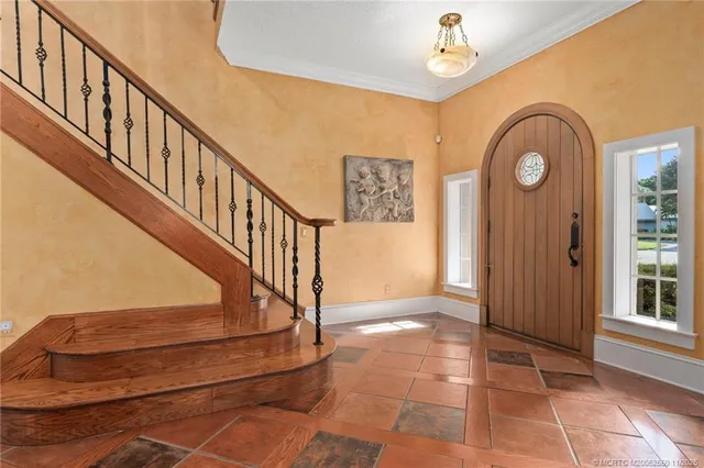 a view of an entryway with wooden floor