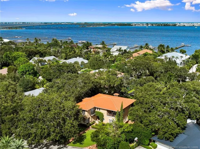 an aerial view of a house with a lake view