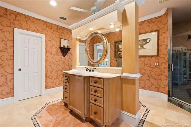 a bathroom with a granite countertop sink a mirror and a shower