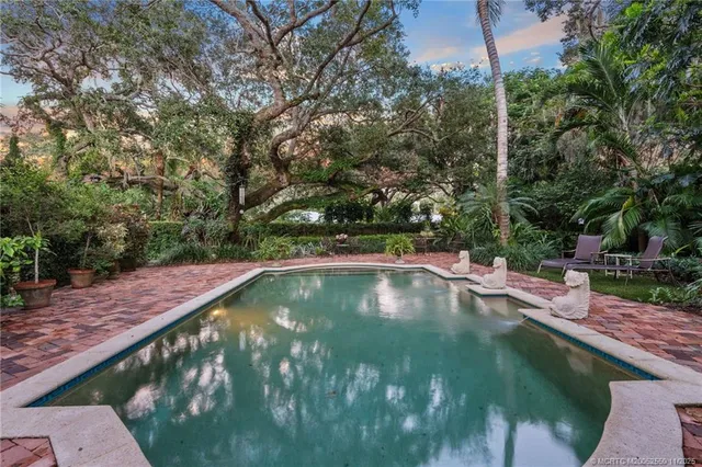 a view of a swimming pool with a yard