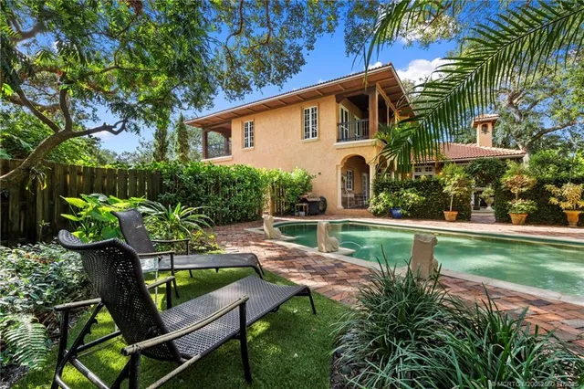 a front view of house with yard and outdoor seating