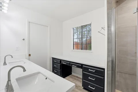 a bathroom with a sink and a bathtub