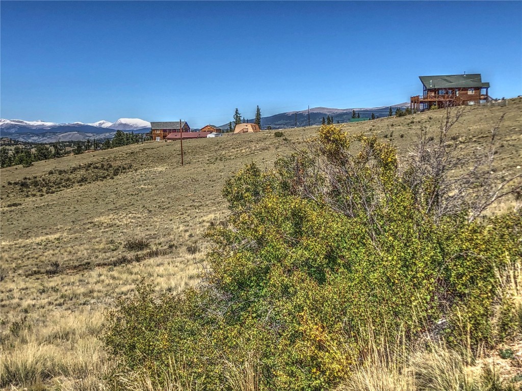 669 Travois Road Como, CO 80456 - Photo 2 of 17 a view of a large building with mountains in the background