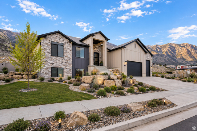 728 East Mountain Road North Ogden, UT 84414 - Photo 1 of 28 Modern exterior featuring stone and vertical panel siding