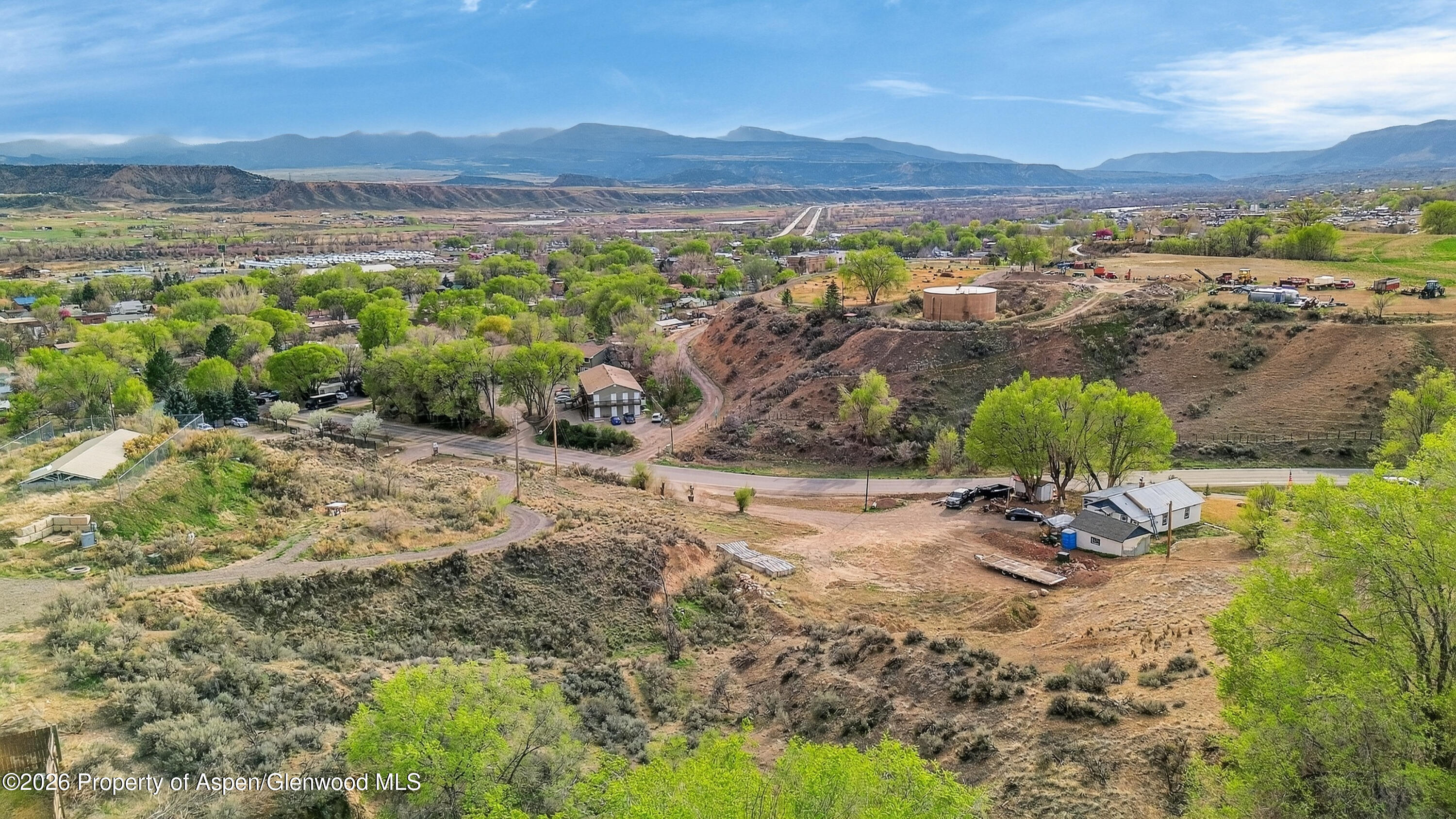 734 North 7th Street Silt, CO 81652 - Photo 4 of 10 a view of a lake with mountains and valleys in the background