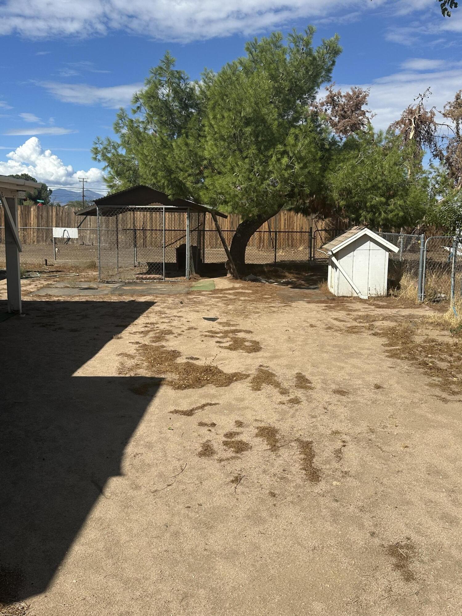 15786 El Centro Road Hesperia, CA 92345 - Photo 12 of 14 a front view of a house with a yard