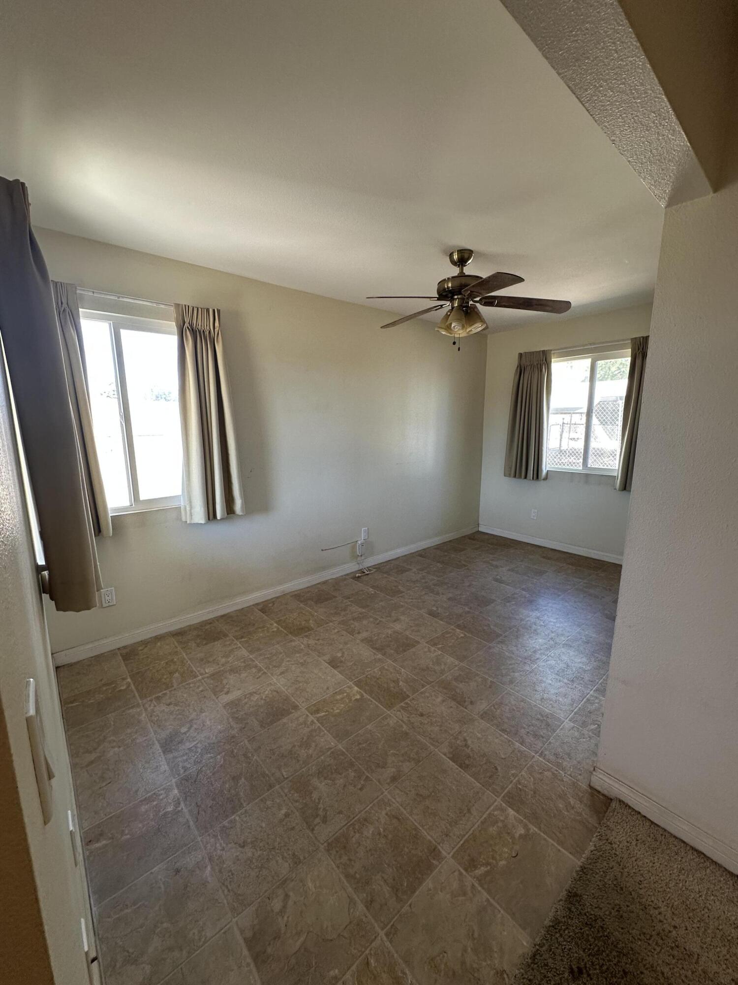 15786 El Centro Road Hesperia, CA 92345 - Photo 3 of 14 an empty room with windows and closet