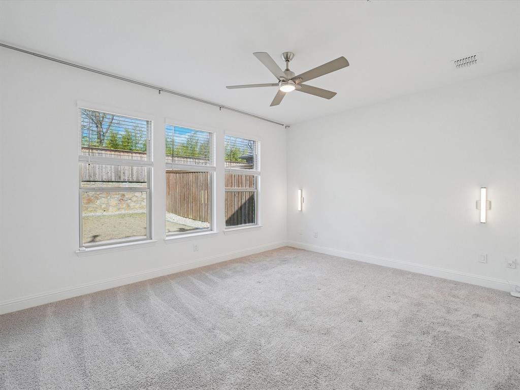 321 Fulton Street Oak Point, TX 75068 - Photo 16 of 36 an empty room with a window