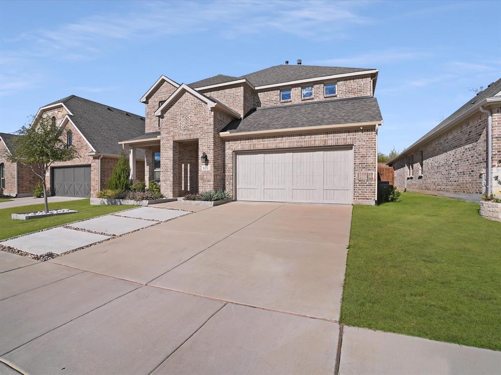321 Fulton Street Oak Point, TX 75068 - Photo 2 of 36 a front view of a house with garden