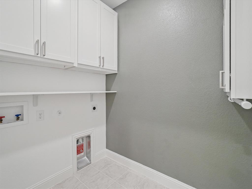 321 Fulton Street Oak Point, TX 75068 - Photo 23 of 36 a utility room with dryer and washer