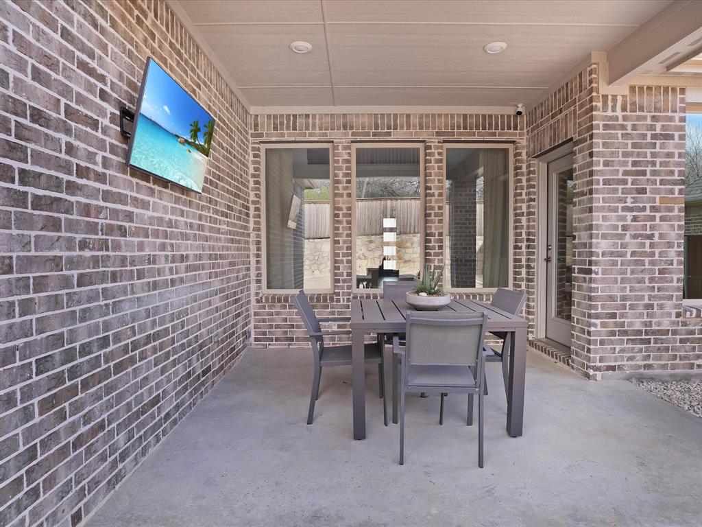 321 Fulton Street Oak Point, TX 75068 - Photo 32 of 36 a dining room with furniture and wooden floor