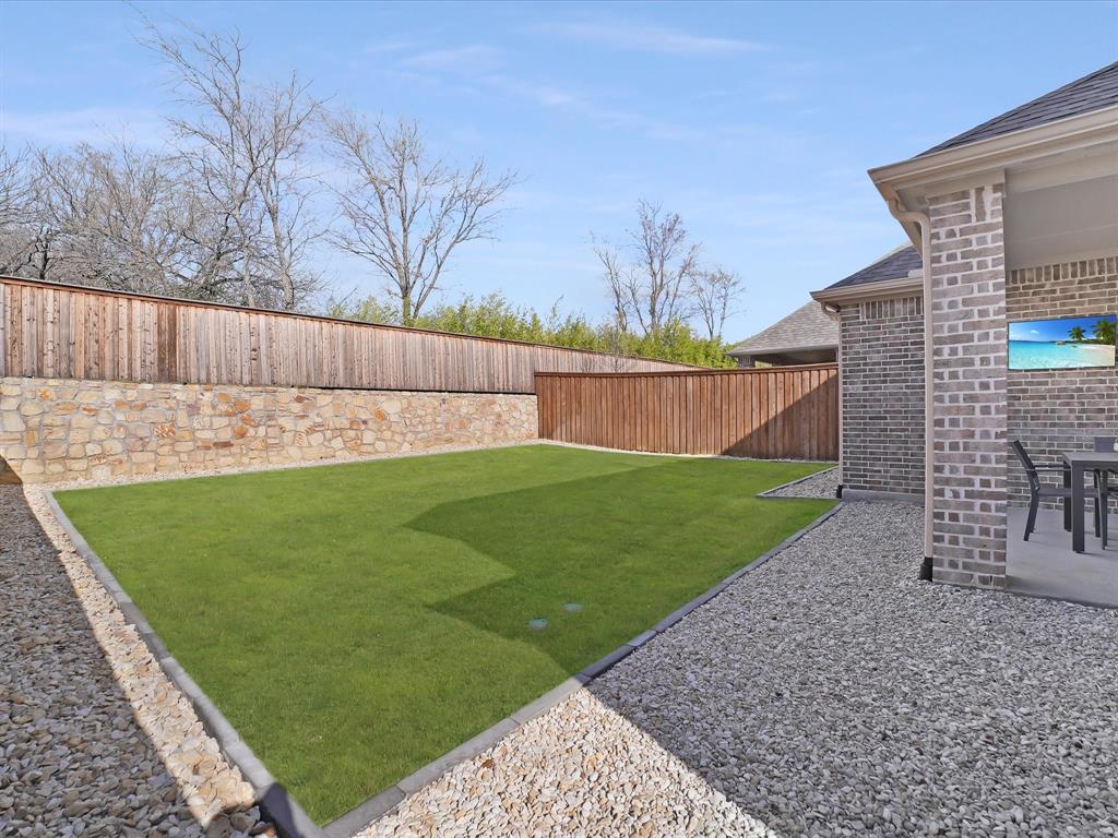 321 Fulton Street Oak Point, TX 75068 - Photo 34 of 36 a view of a back yard