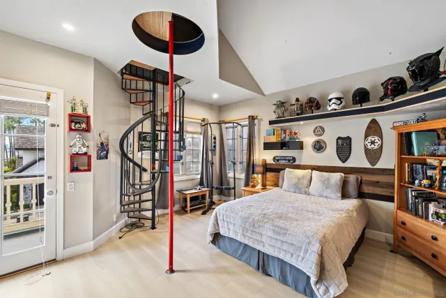 a bedroom with a bed and a book shelf